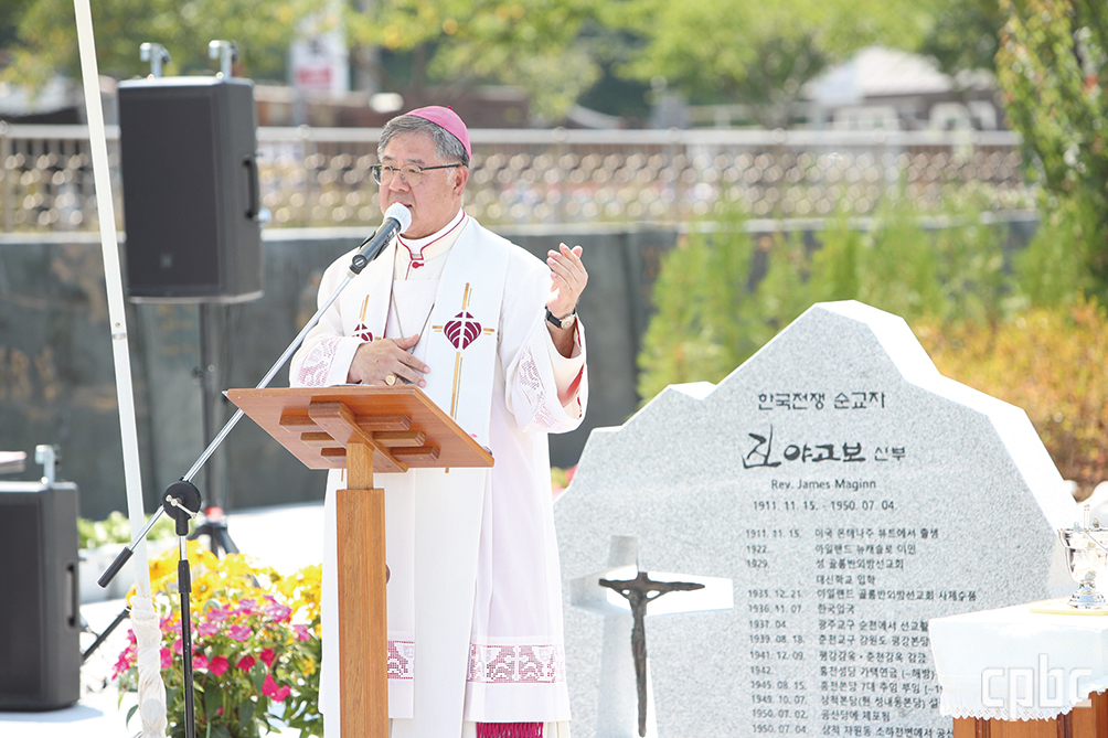 Bishop Blesses Statue and Mural of Columban Martyr