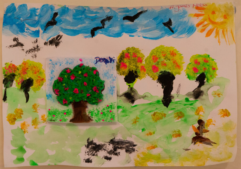 Colorful childlike landscape painting: blue sky with birds, bright sun, and green trees with red flowers on a light background.